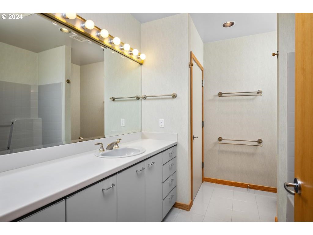 2020 Southwest Market St Drive, Unit 101 Portland, OR 97201 - Photo 26 of 33 a bathroom with a double vanity sink and mirror
