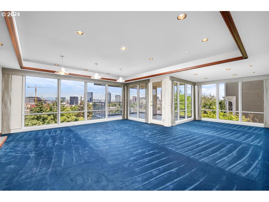 2020 Southwest Market St Drive, Unit 101 Portland, OR 97201 - Photo 5 of 33 a view of an empty room with wooden floor and a window