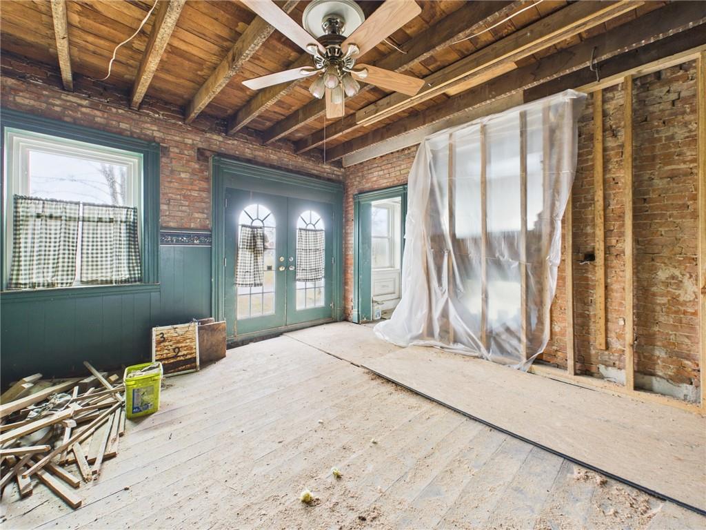 3698 Frew Mill Road New Castle, PA 16101 - Photo 14 of 25 a bedroom with a bed next to a window