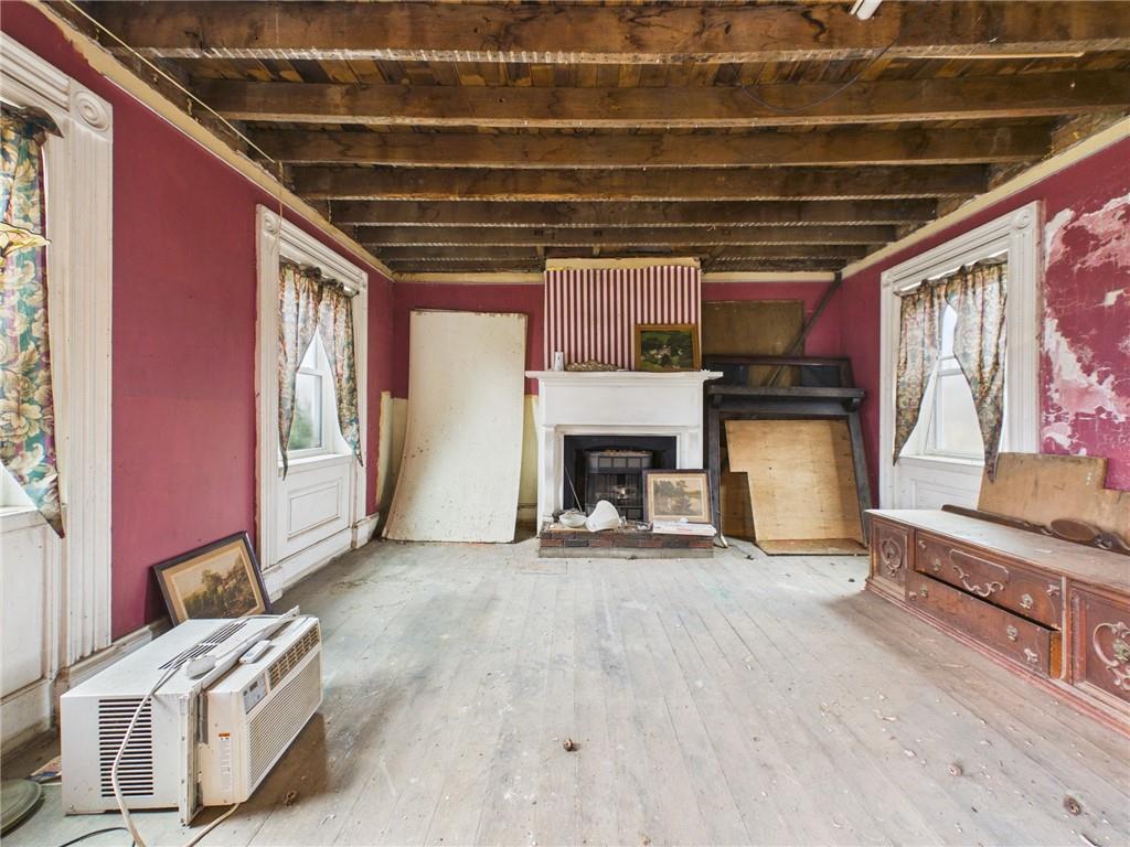 3698 Frew Mill Road New Castle, PA 16101 - Photo 15 of 25 a view of an empty room with a fireplace