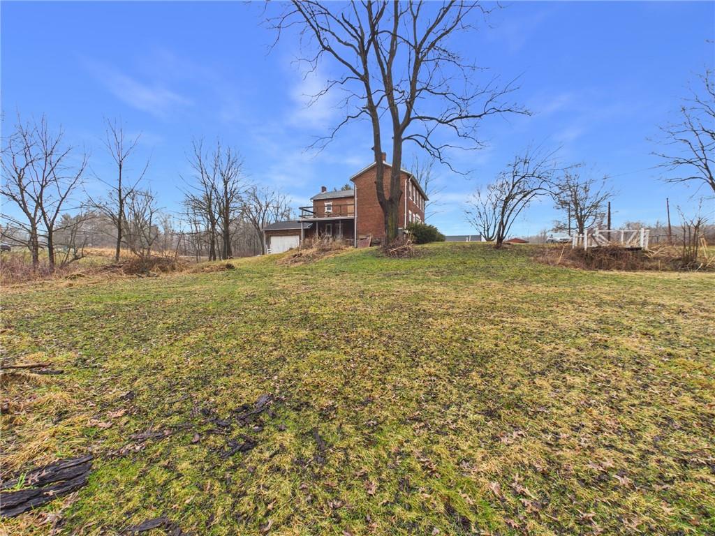 3698 Frew Mill Road New Castle, PA 16101 - Photo 6 of 25 a backyard of a house with lots of green space