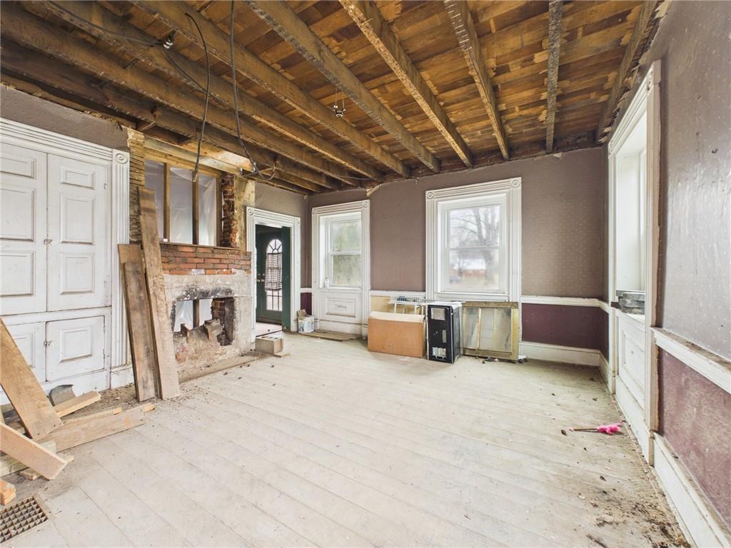 3698 Frew Mill Road New Castle, PA 16101 - Photo 9 of 25 a view of a livingroom with a fireplace and window