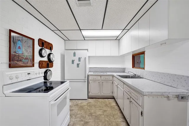 a bathroom with a sink toilet a mirror and vanity