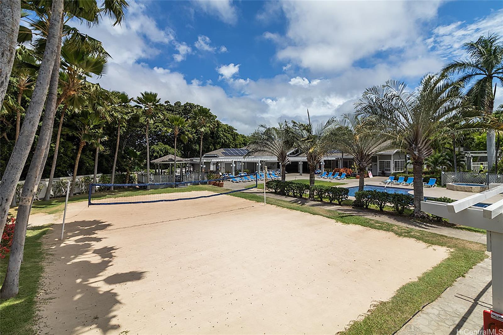 625 Mananai Place, Unit 24A Honolulu, HI 96818 - Photo 16 of 18 a swimming pool with outdoor seating and yard
