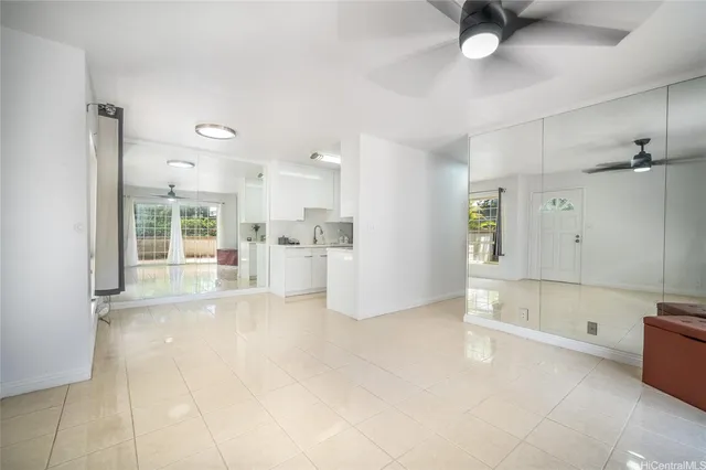 a view of a kitchen with a sink hardwood floor and a window