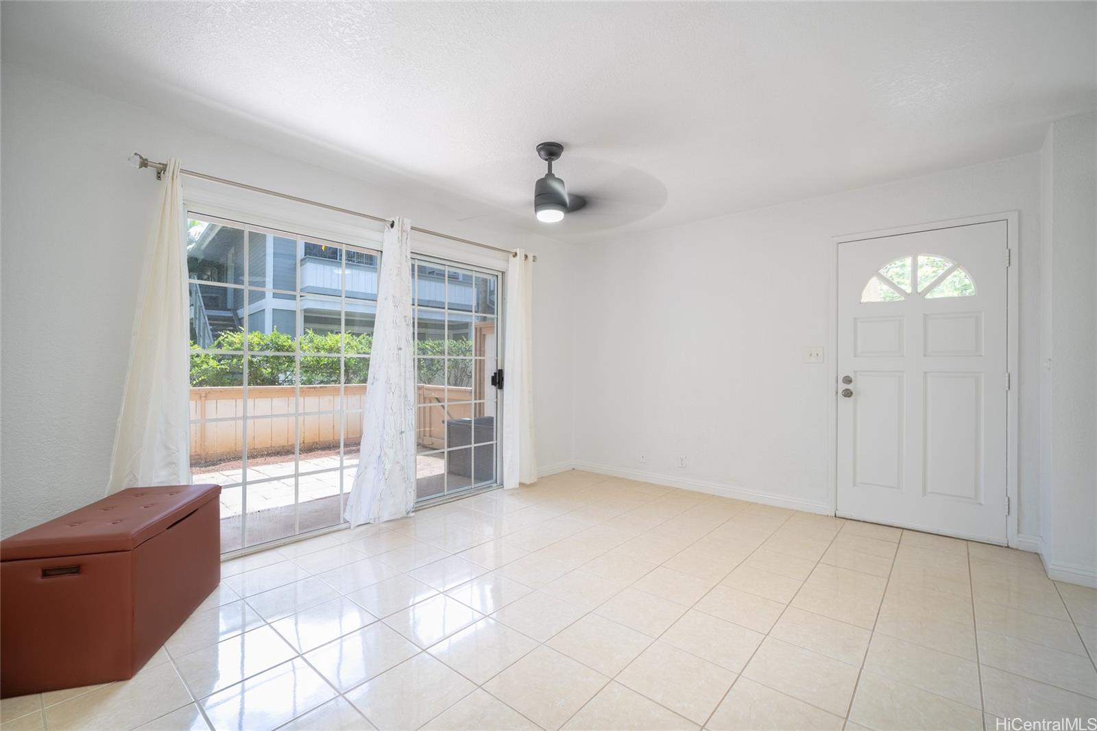 625 Mananai Place, Unit 24A Honolulu, HI 96818 - Photo 5 of 18 an empty room with windows and outdoor view