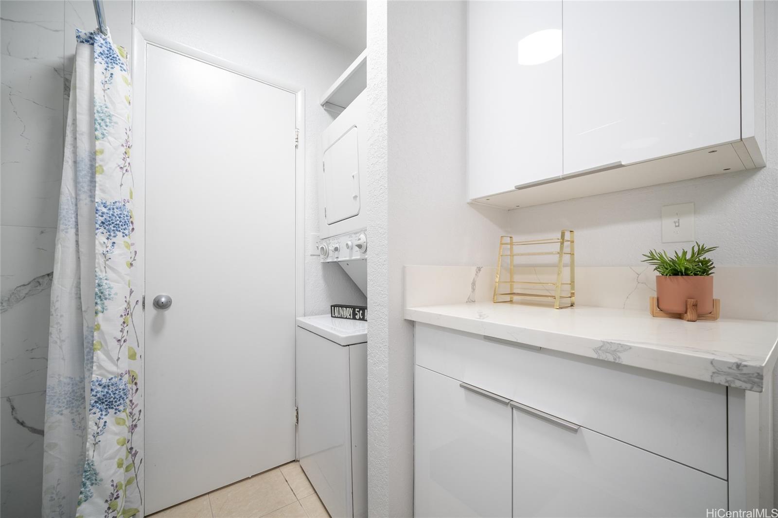 625 Mananai Place, Unit 24A Honolulu, HI 96818 - Photo 10 of 18 a kitchen with a sink and cabinets
