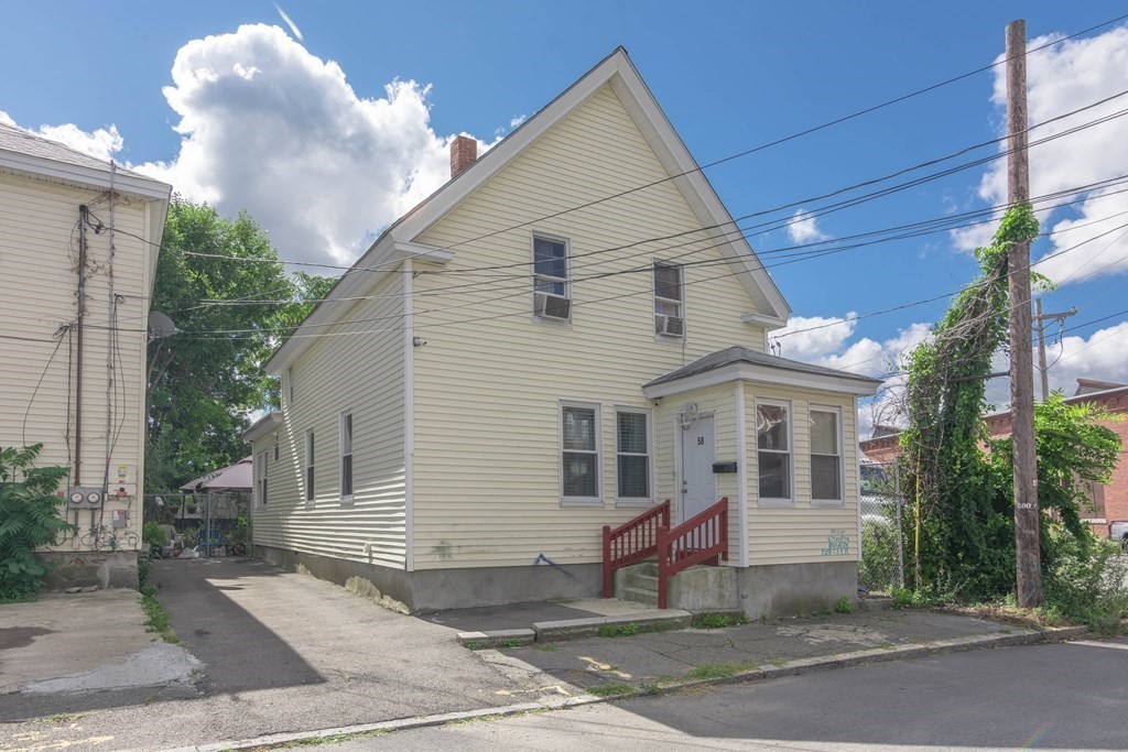 58 Lake Street Lawrence, MA 01841 - Photo 1 of 26 a view of a white house