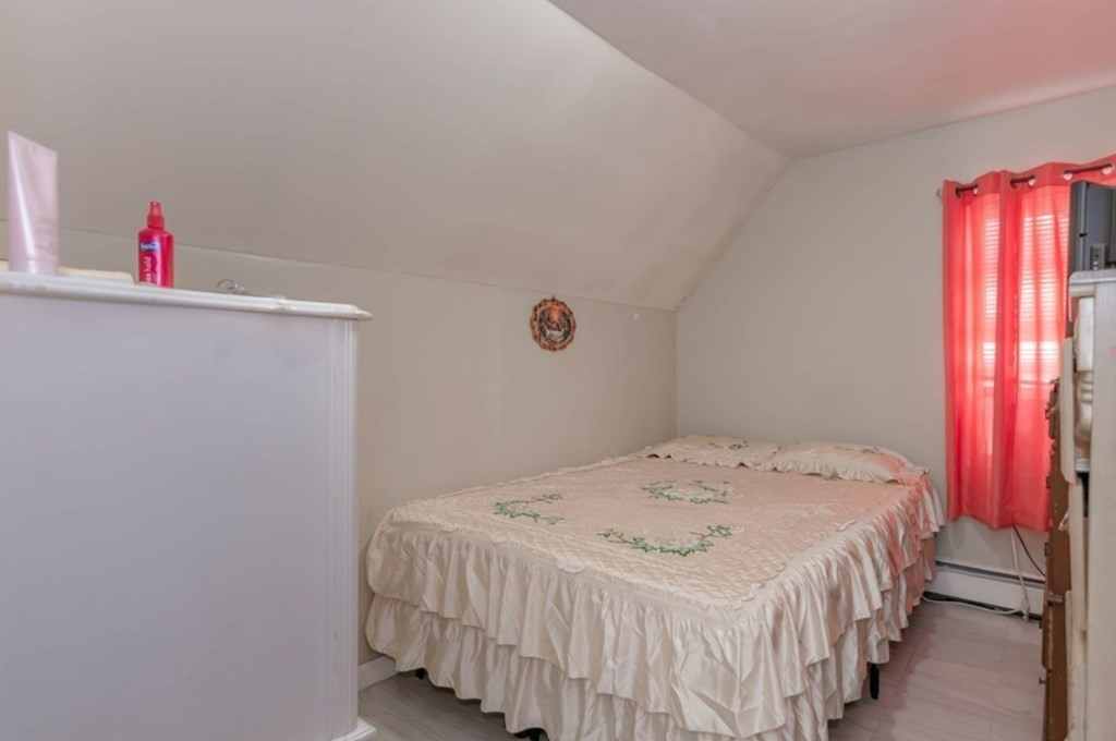 58 Lake Street Lawrence, MA 01841 - Photo 15 of 26 a bedroom with a bed and a window
