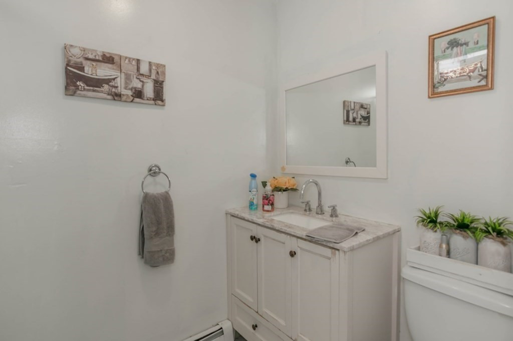 58 Lake Street Lawrence, MA 01841 - Photo 24 of 26 a bathroom with a sink and a mirror
