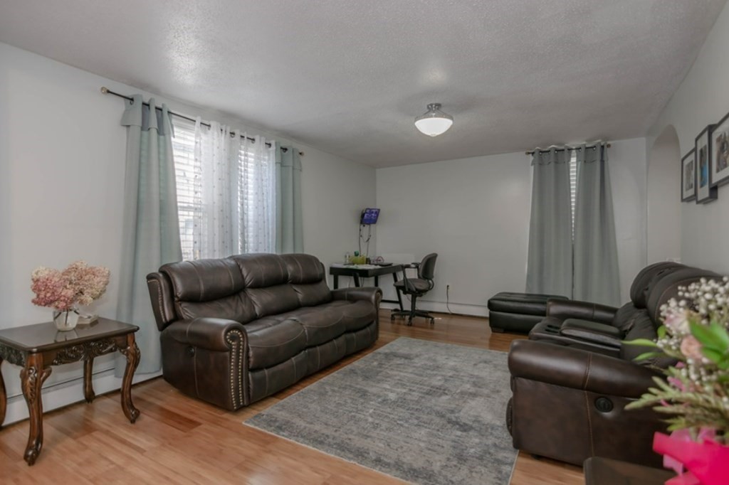 58 Lake Street Lawrence, MA 01841 - Photo 3 of 26 a living room with furniture and a window