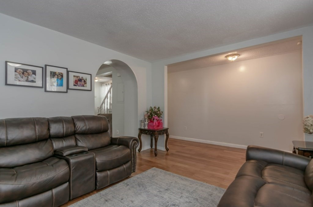 58 Lake Street Lawrence, MA 01841 - Photo 4 of 26 a living room with furniture and a wooden floor