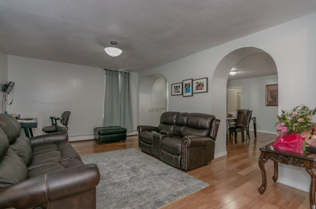 58 Lake Street Lawrence, MA 01841 - Photo 5 of 26 a living room with furniture and wooden floor