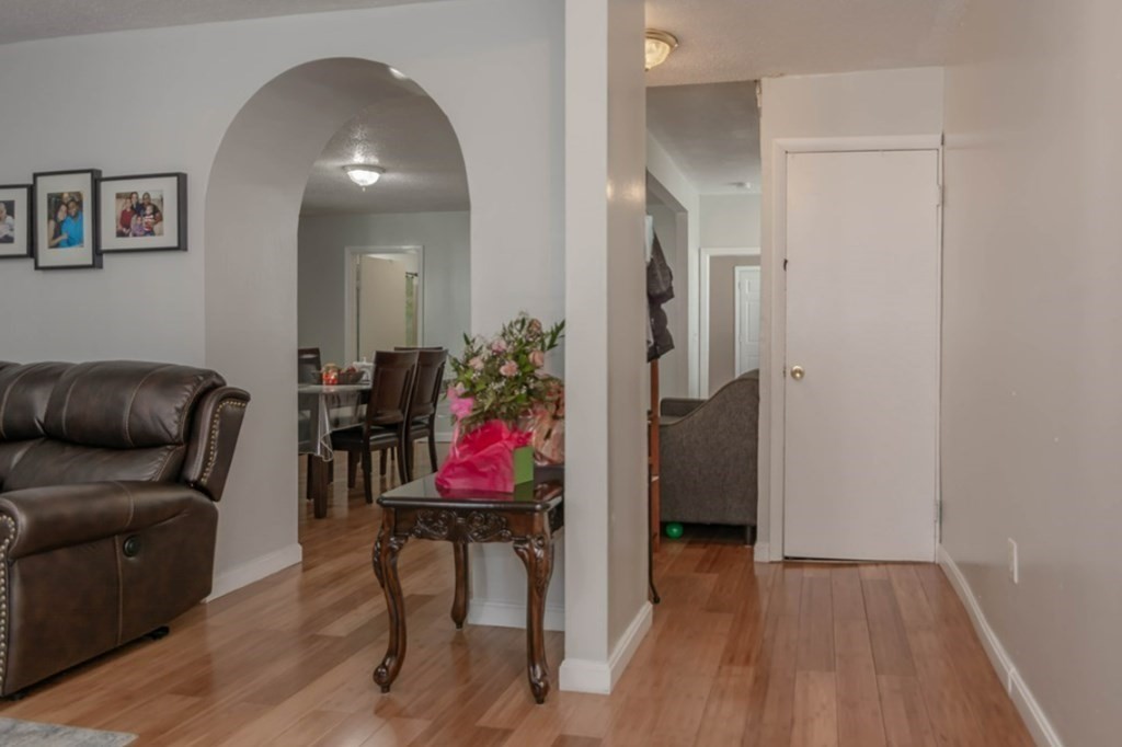 58 Lake Street Lawrence, MA 01841 - Photo 6 of 26 a living room with furniture and a wooden floor