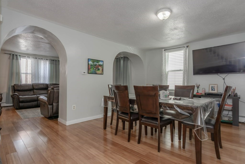 58 Lake Street Lawrence, MA 01841 - Photo 7 of 26 a view of a dining room with furniture window and wooden floor