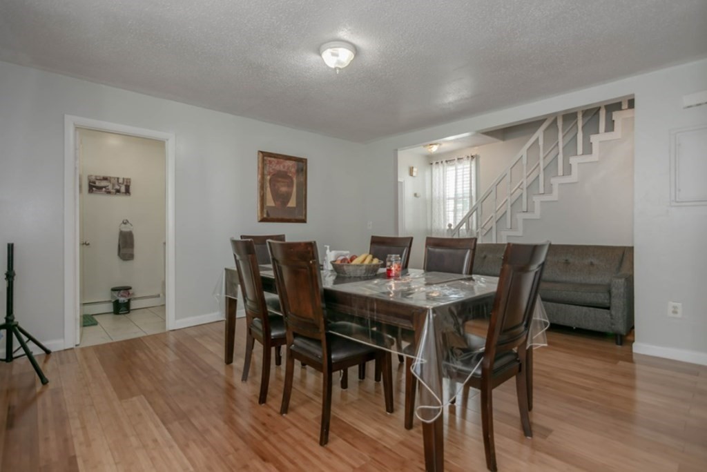 58 Lake Street Lawrence, MA 01841 - Photo 9 of 26 a view of a dining room with furniture and wooden floor