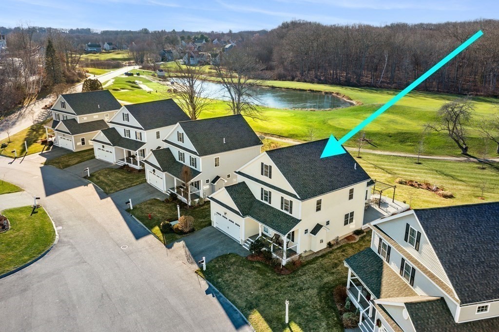 a aerial view of a house with a swimming pool