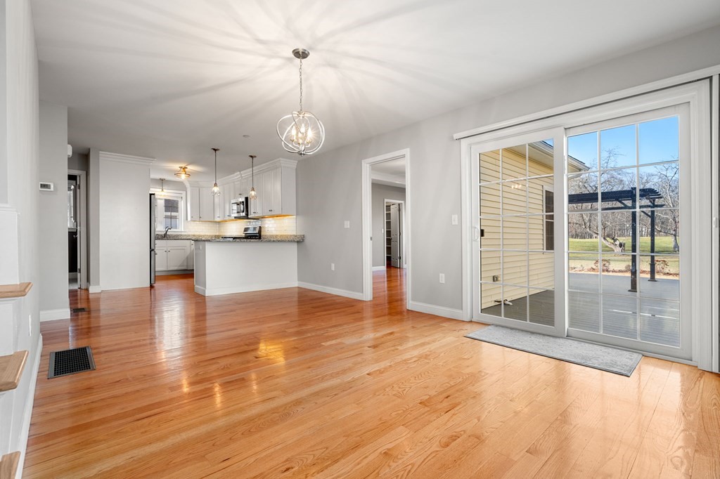 8 Comanche Circle, Unit 4 Haverhill, MA 01835 - Photo 13 of 19 a view of a kitchen with wooden floor and a kitchen