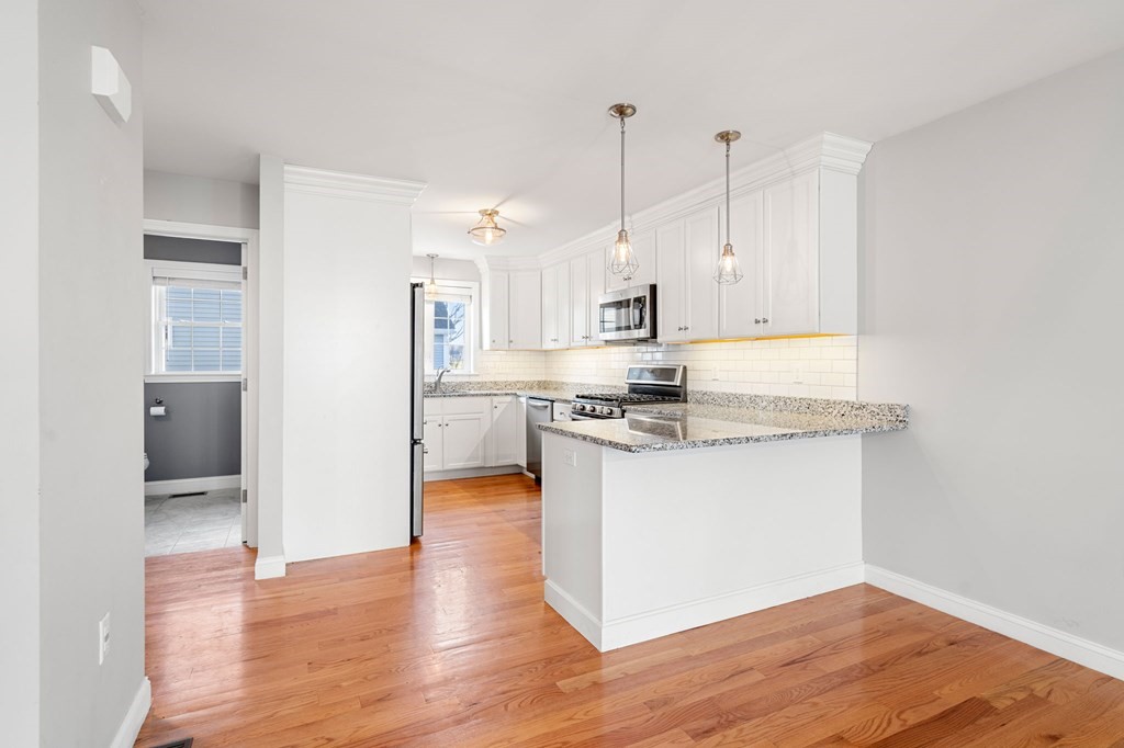 8 Comanche Circle, Unit 4 Haverhill, MA 01835 - Photo 19 of 19 a view of kitchen with wooden floor