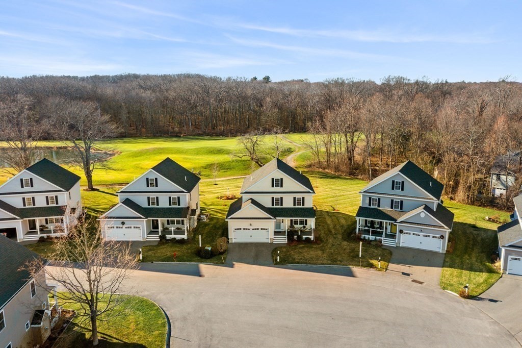 8 Comanche Circle, Unit 4 Haverhill, MA 01835 - Photo 4 of 19 a aerial view of a house with a swimming pool and a yard