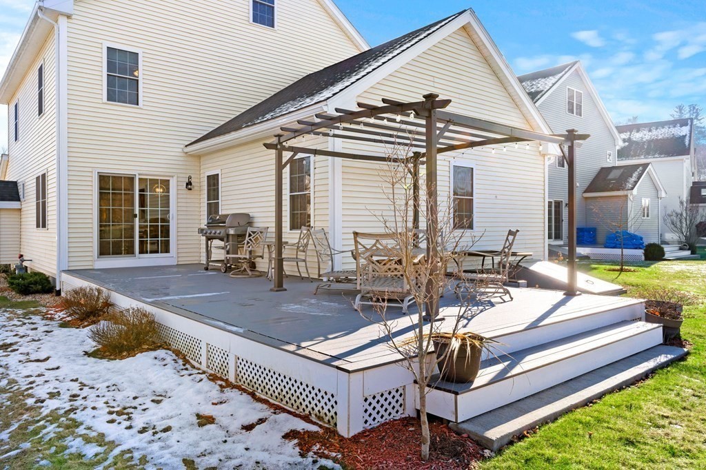 8 Comanche Circle, Unit 4 Haverhill, MA 01835 - Photo 7 of 19 a view of a dinning table and chairs in the patio