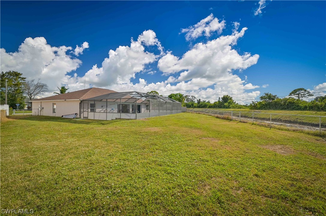 200 Roat Street Lehigh Acres, FL 33936 - Photo 34 of 35 a view of a swimming pool with an outdoor space