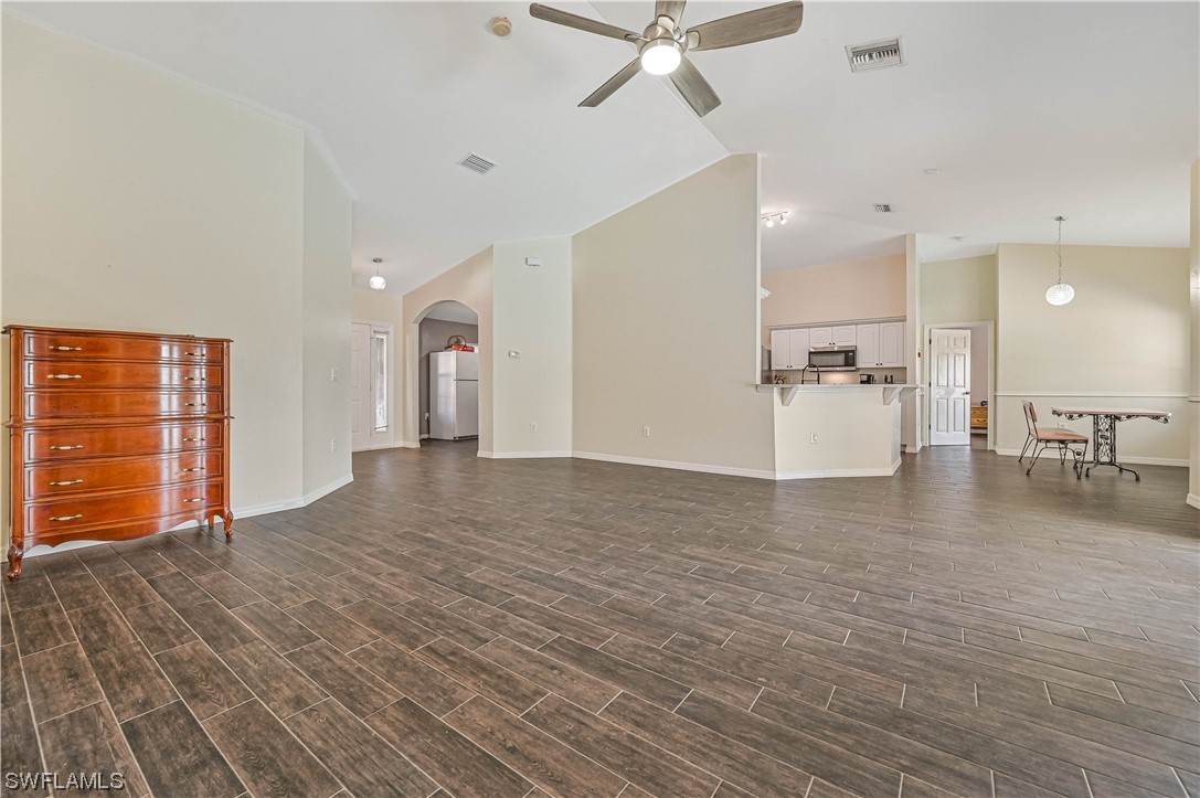 200 Roat Street Lehigh Acres, FL 33936 - Photo 10 of 35 a view of empty room with wooden floor