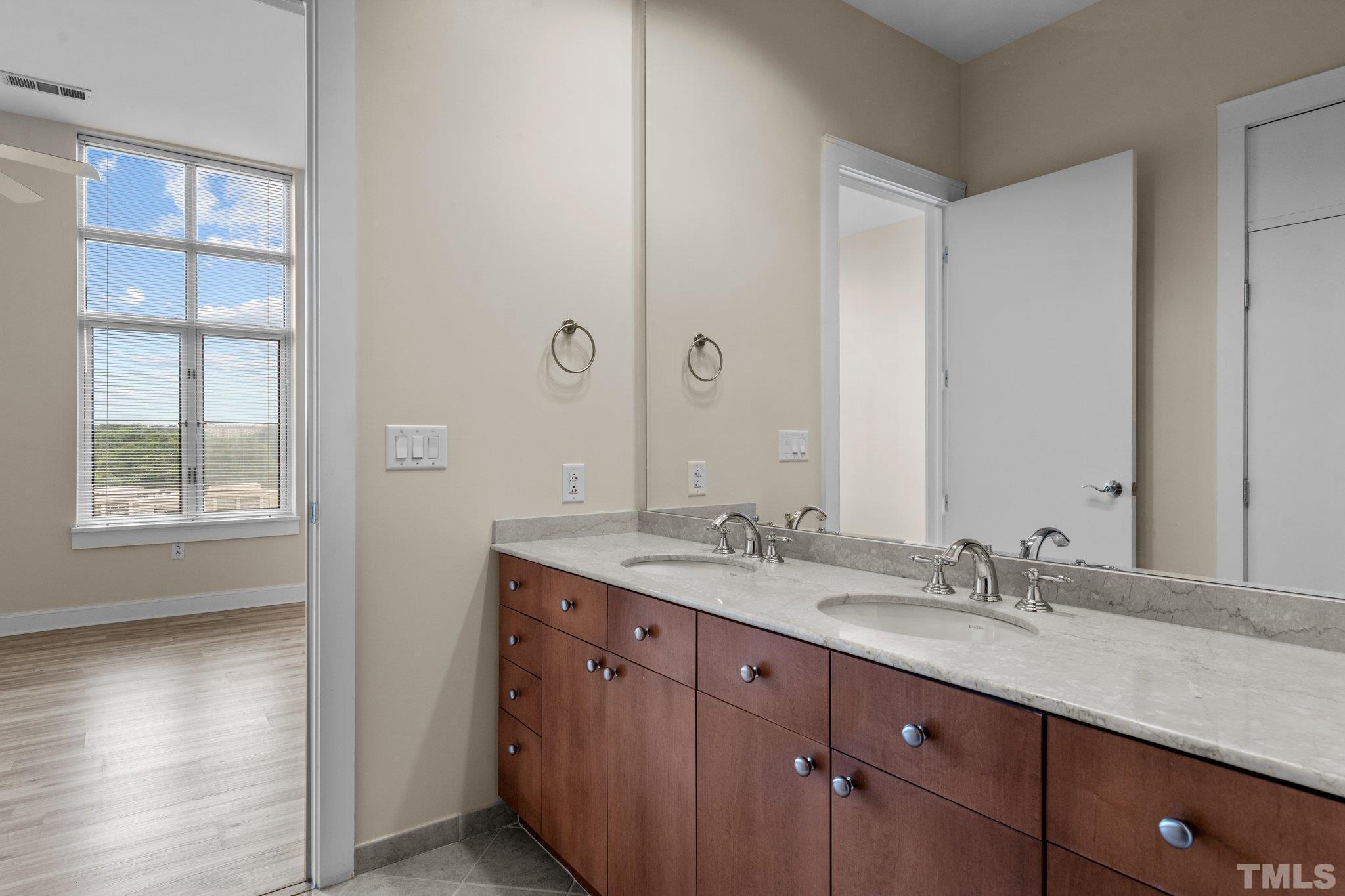618 North Boylan Avenue, Unit 1032 Raleigh, NC 27603 - Photo 16 of 69 a bathroom with a granite countertop sink mirror and double