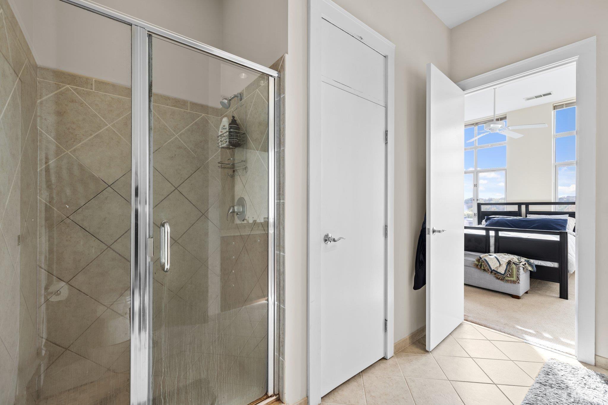 618 North Boylan Avenue, Unit 1032 Raleigh, NC 27603 - Photo 17 of 69 a bathroom with a shower and a sink