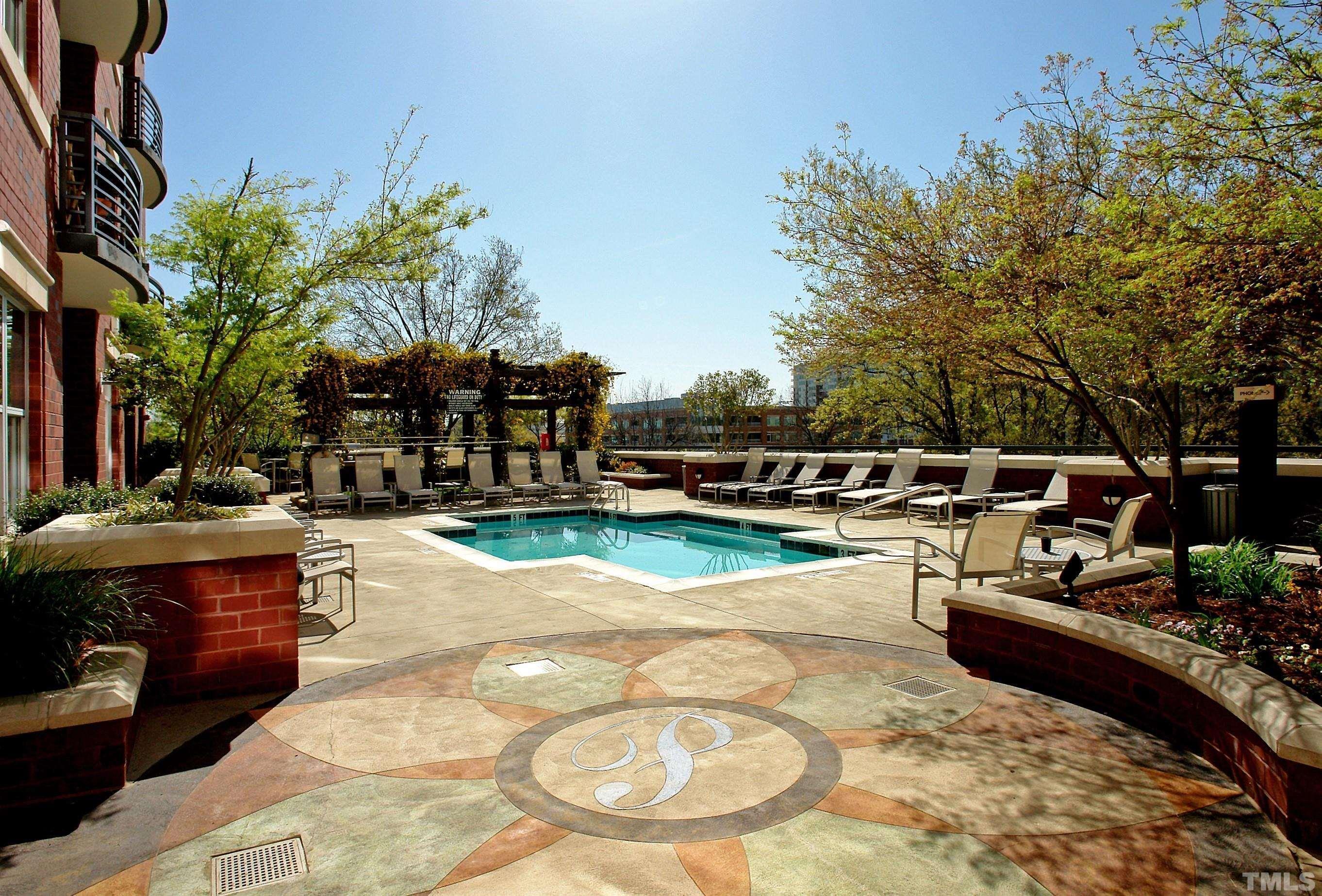 618 North Boylan Avenue, Unit 1032 Raleigh, NC 27603 - Photo 32 of 69 a view of a swimming pool with a patio