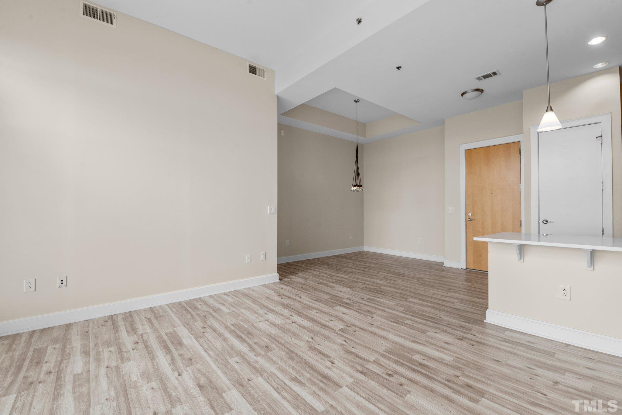 618 North Boylan Avenue, Unit 1032 Raleigh, NC 27603 - Photo 4 of 69 a view of an empty room with wooden floor
