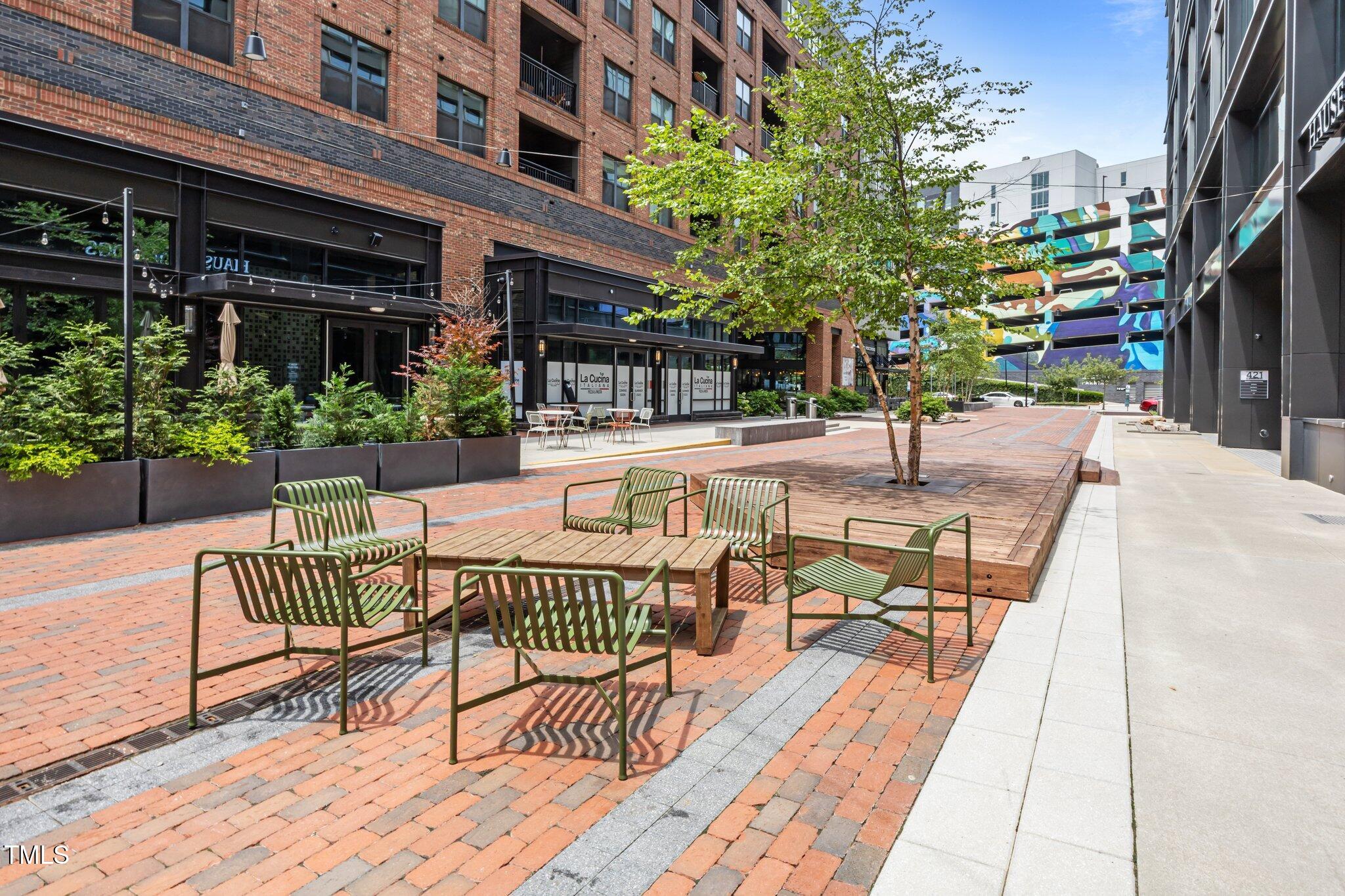 618 North Boylan Avenue, Unit 1032 Raleigh, NC 27603 - Photo 46 of 69 a view of a patio with couches table and chairs and potted plants