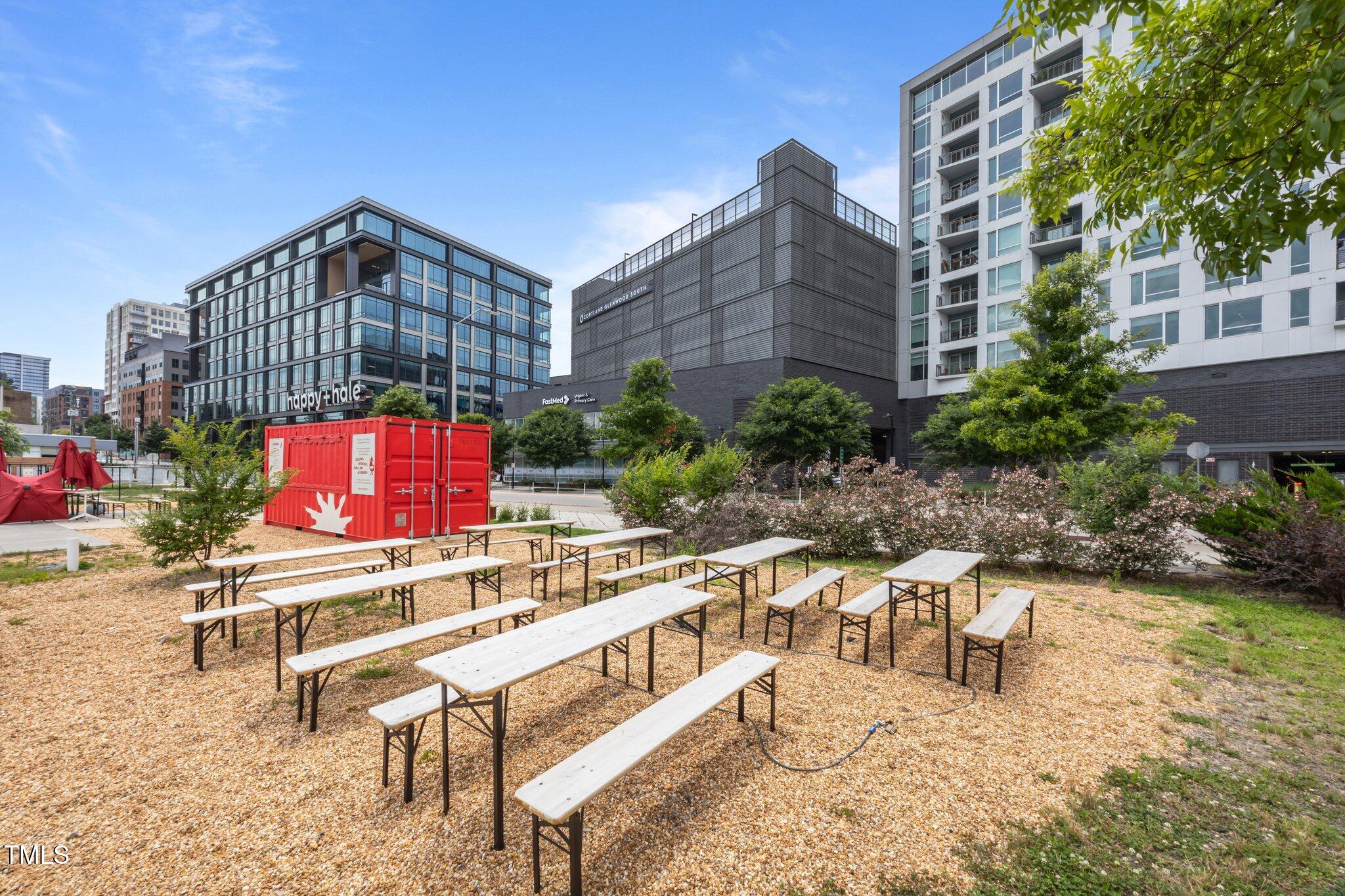 618 North Boylan Avenue, Unit 1032 Raleigh, NC 27603 - Photo 51 of 69 a view of building with outdoor space and seating area