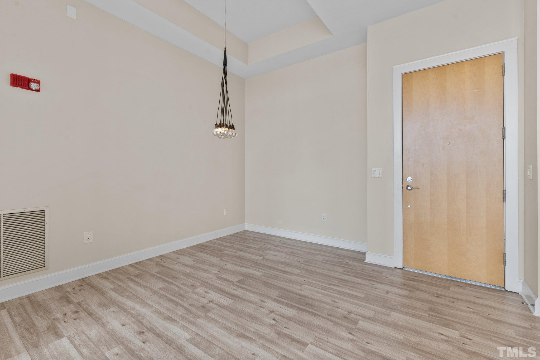 618 North Boylan Avenue, Unit 1032 Raleigh, NC 27603 - Photo 9 of 69 a view of an empty room with wooden floor