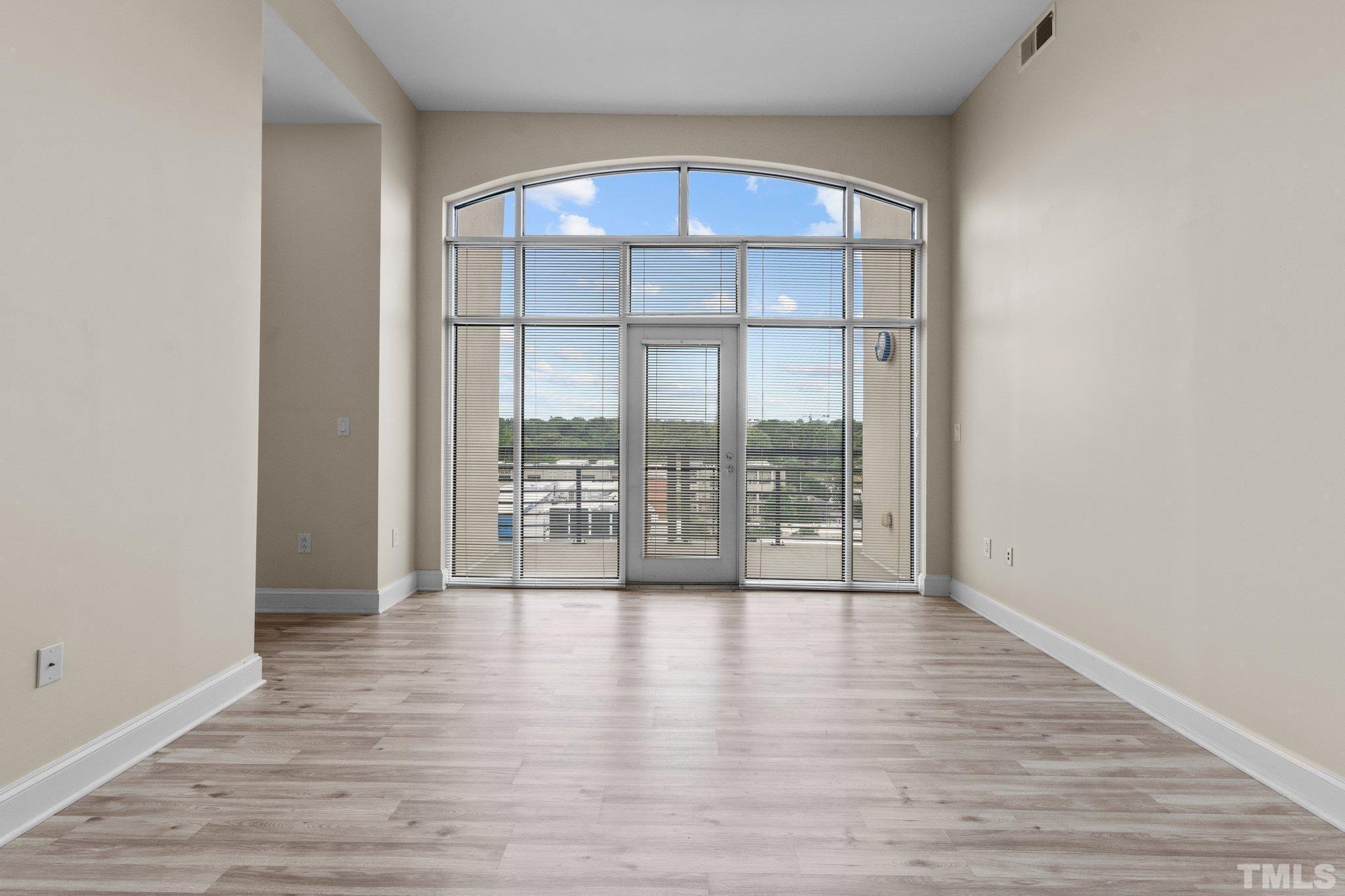 618 North Boylan Avenue, Unit 1032 Raleigh, NC 27603 - Photo 10 of 69 wooden floor in an empty room with a window