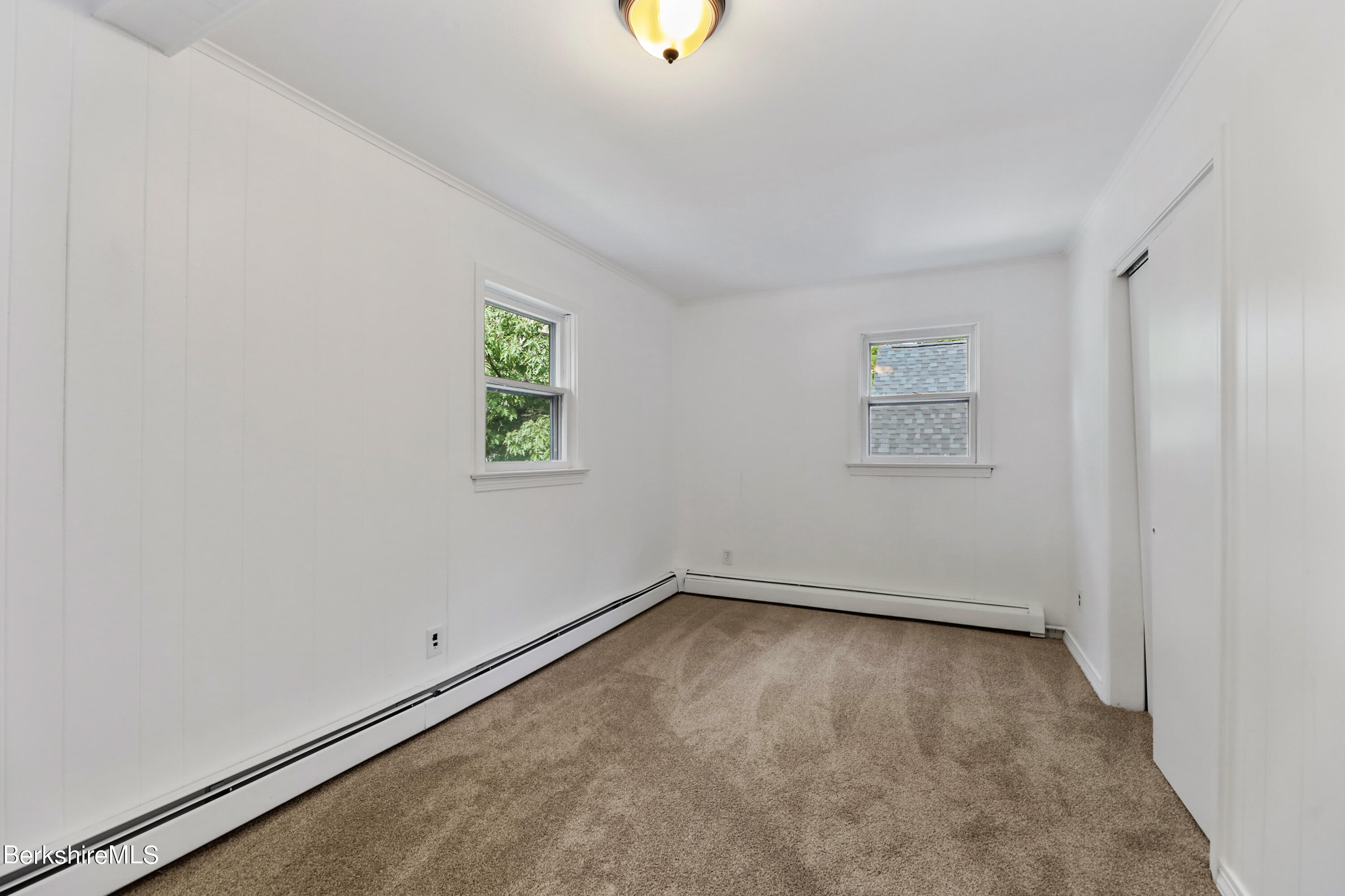99 Lyman Street Pittsfield, MA 01201 - Photo 22 of 38 an empty room with windows