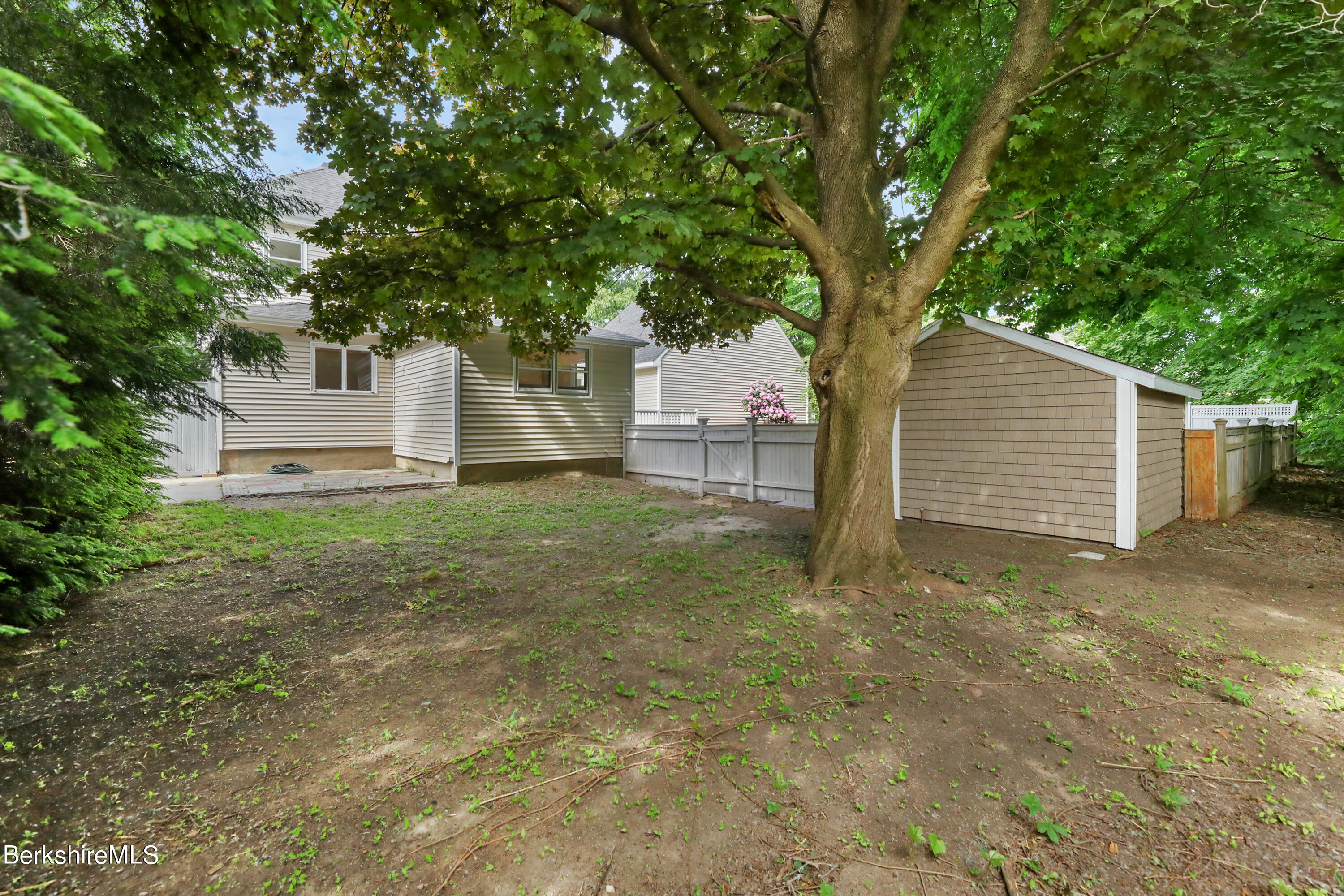 99 Lyman Street Pittsfield, MA 01201 - Photo 34 of 38 a house with trees in front of it