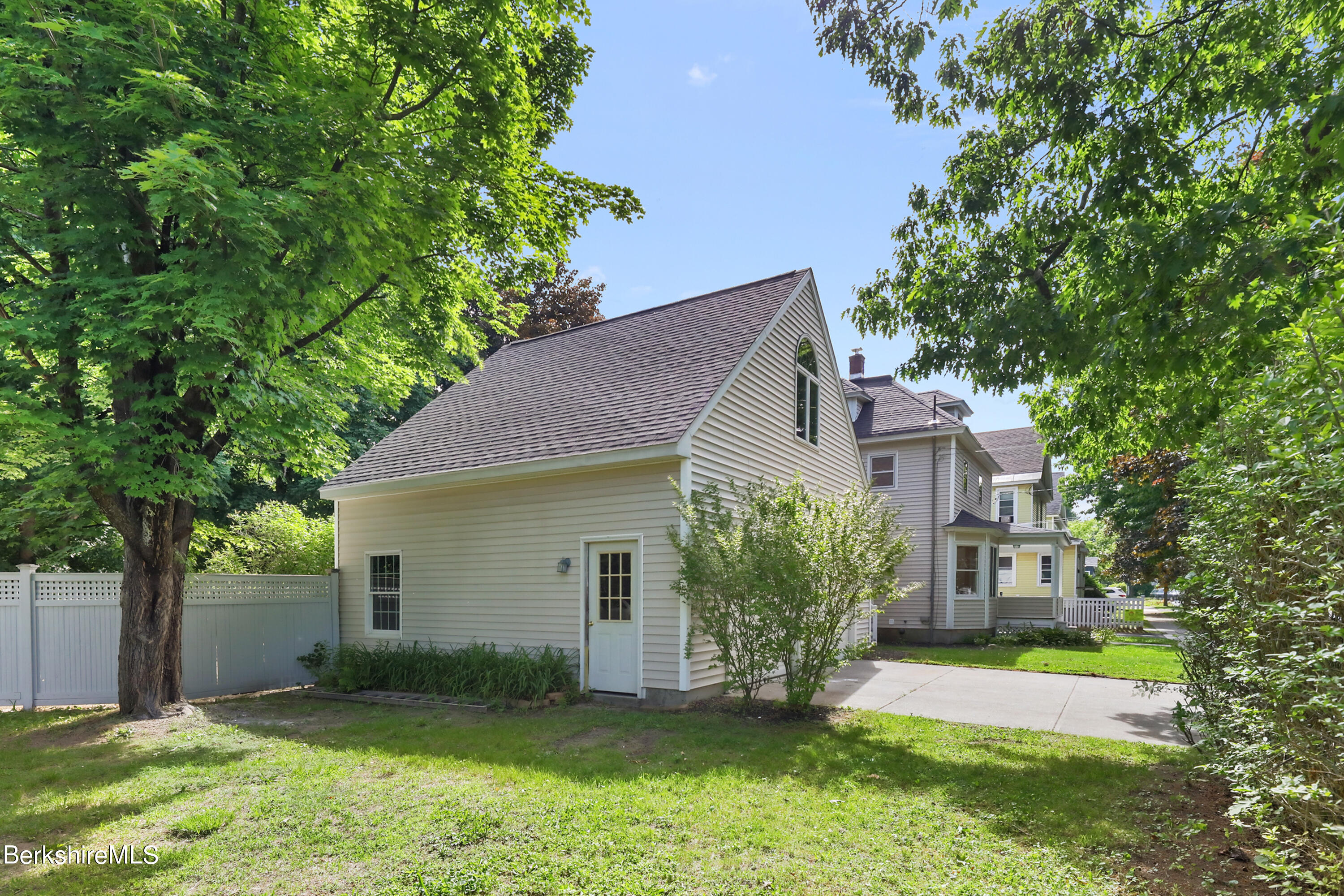 99 Lyman Street Pittsfield, MA 01201 - Photo 4 of 38 front view of a house with a yard