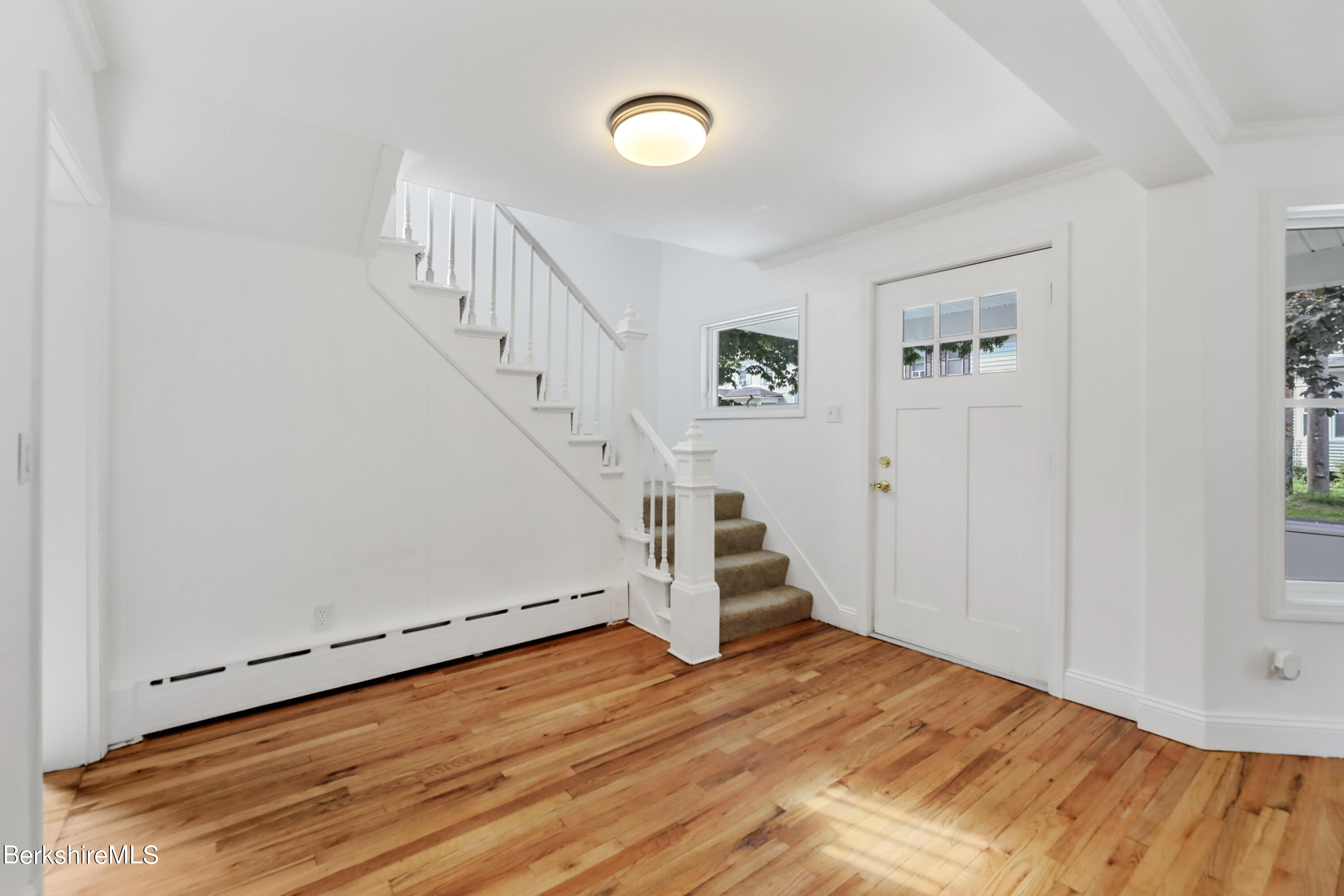 99 Lyman Street Pittsfield, MA 01201 - Photo 5 of 38 a view of entryway with wooden floor