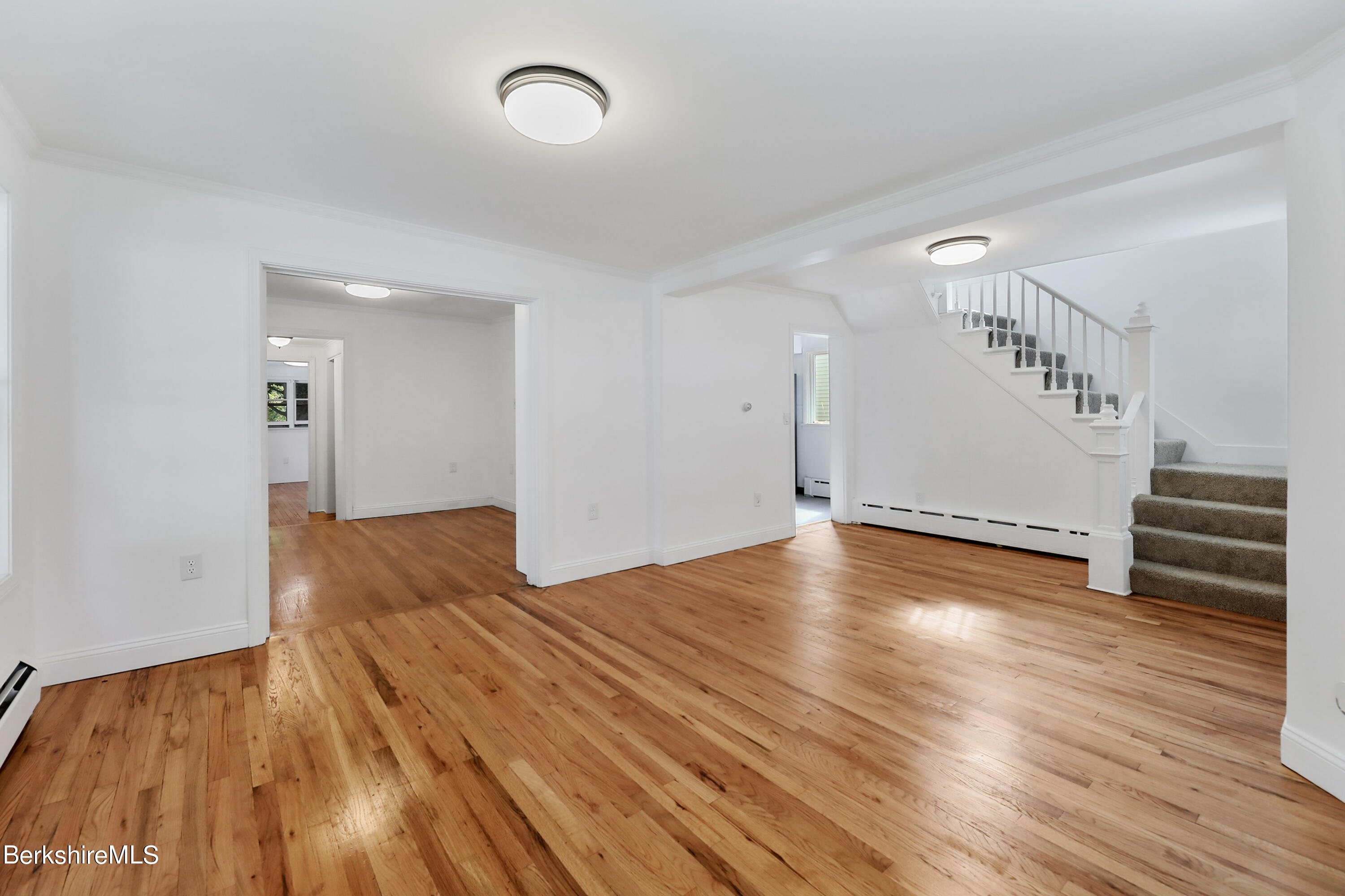 99 Lyman Street Pittsfield, MA 01201 - Photo 9 of 38 a view of empty room with wooden floor