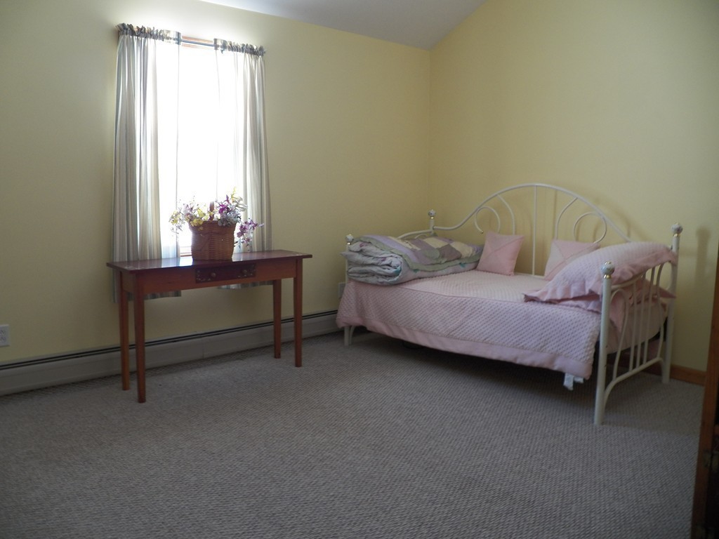 1376 Patrill Hollow Road Hardwick, MA 01082 - Photo 13 of 16 a bedroom with a bed chair and window
