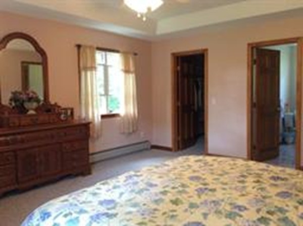 1376 Patrill Hollow Road Hardwick, MA 01082 - Photo 14 of 16 a view of a livingroom with wooden floor and closet