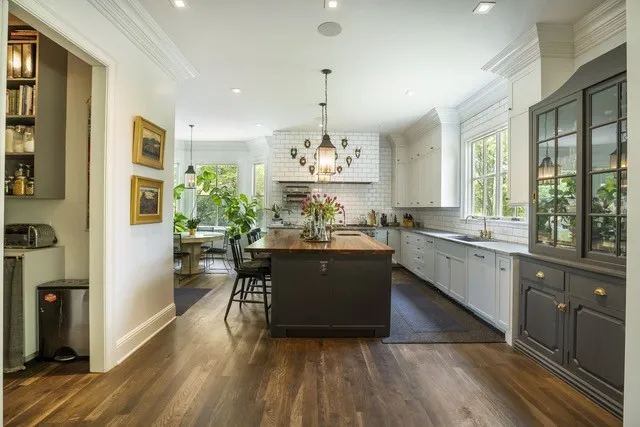 a large living room with stainless steel appliances granite countertop furniture and a kitchen view