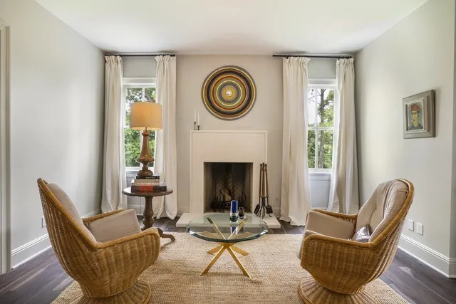 a living room with furniture and a fireplace