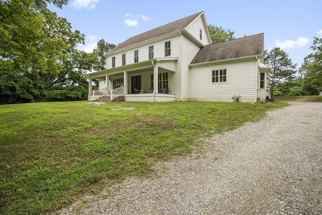 815 Sneed Road West Franklin, TN 37069 - Photo 32 of 32 a front view of a house with a garden