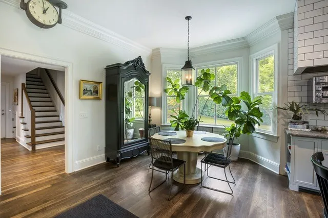 a view of a dining room with furniture window and wooden floor