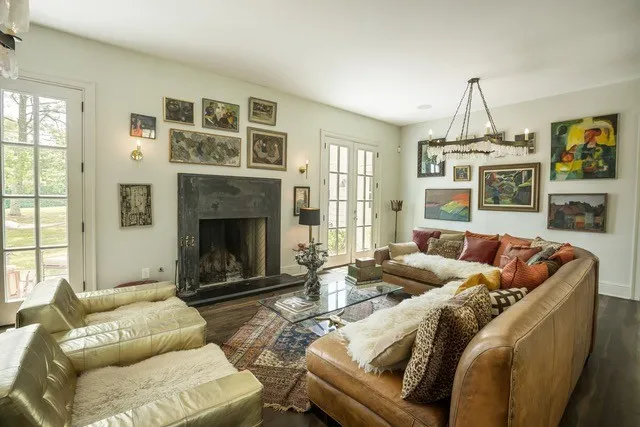 a living room with furniture windows and a fireplace