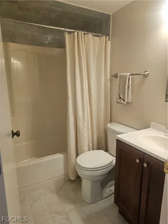 view of a bathroom with a glass door shower