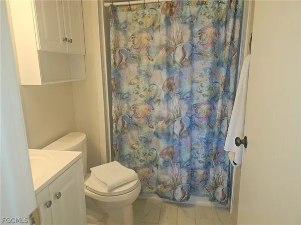 a bathroom with a sink and toilet