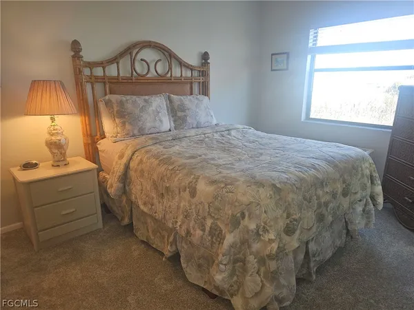 a white toilet sitting next to a shower curtain